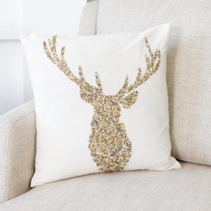 Sequinned Stag Cushion- Beautifully embellished in gold, bronze and warm silver beading, this pure cotton ivory cushion is updated for the festive season. €39.95