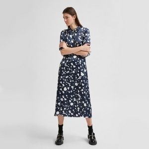Dark blue satin dress with a white spot design. Wear this to the office with heels or with runners for an everyday look.