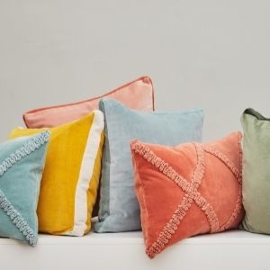 Velvet cushions in a variety of shapes, colours and sizes.