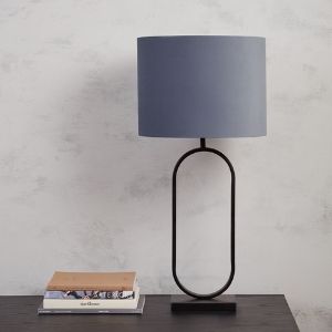 Oversized table lamp with a velvet lampshade. 