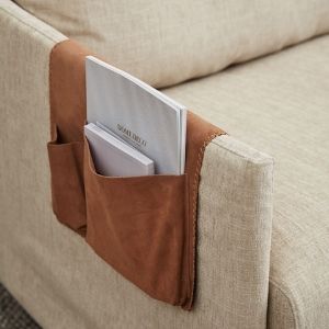 This is a sofa organiser that will keep your accessories safe as you watch TV.
