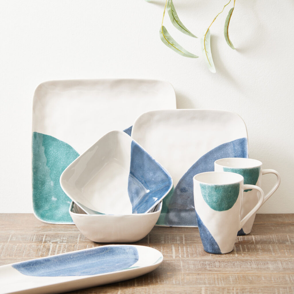 abstract green, blue and white dinner set. the set includes mugs, square salad plates, square bowls, square dinner plates and rectangular plates. made from stoneware.