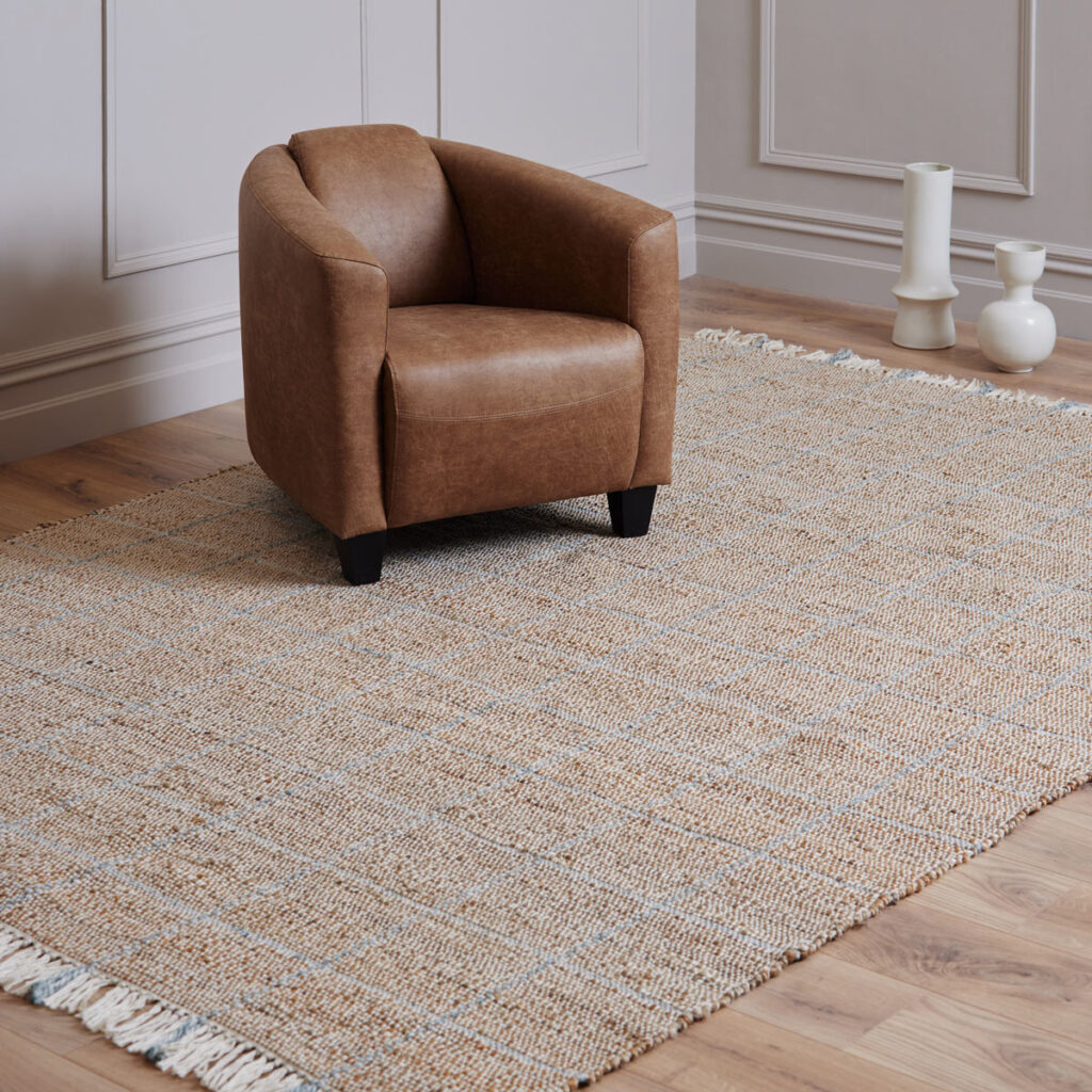 100% jute rug with blue squares and blue and white fringing