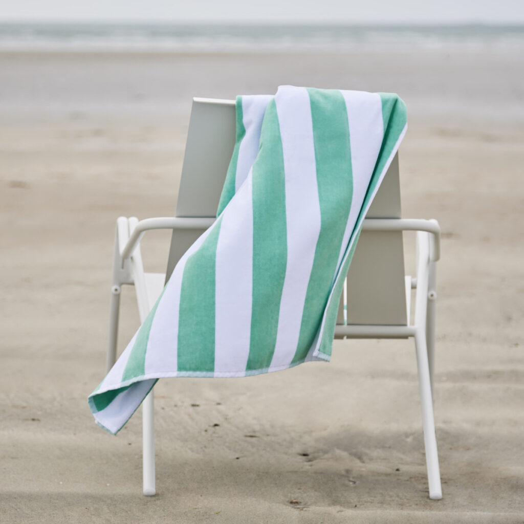 green and white striped beach towel