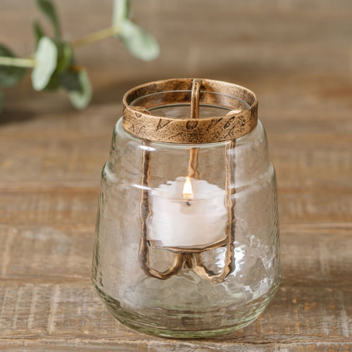 nia tealight candle holder made from iron and glass with an antique gold finish