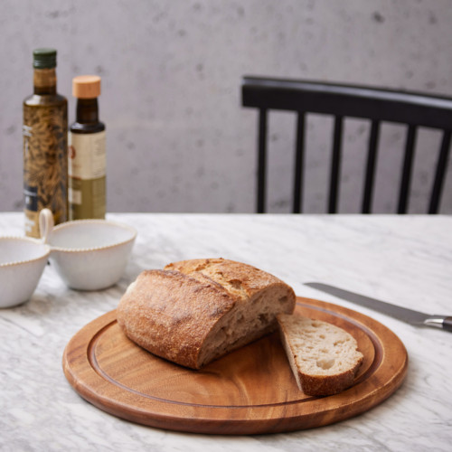Round Chopping Board with food on top.